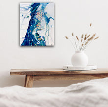 Load image into Gallery viewer, changing Tide in situ on a white wall above a timber bench.