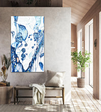 Load image into Gallery viewer, Abstract oil painting on a white background in blue and aqua, shown on a dividing wall.
