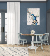 Load image into Gallery viewer, Abstract painting in shades of blue and oyster white with small multicoloured pieces. In situ on a blue dining room wall.
