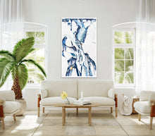 Load image into Gallery viewer, Abstract oil painting on a white background in light blue, mid blue and aqua with multicoloured detail, shown on a beige sitting room wall.
