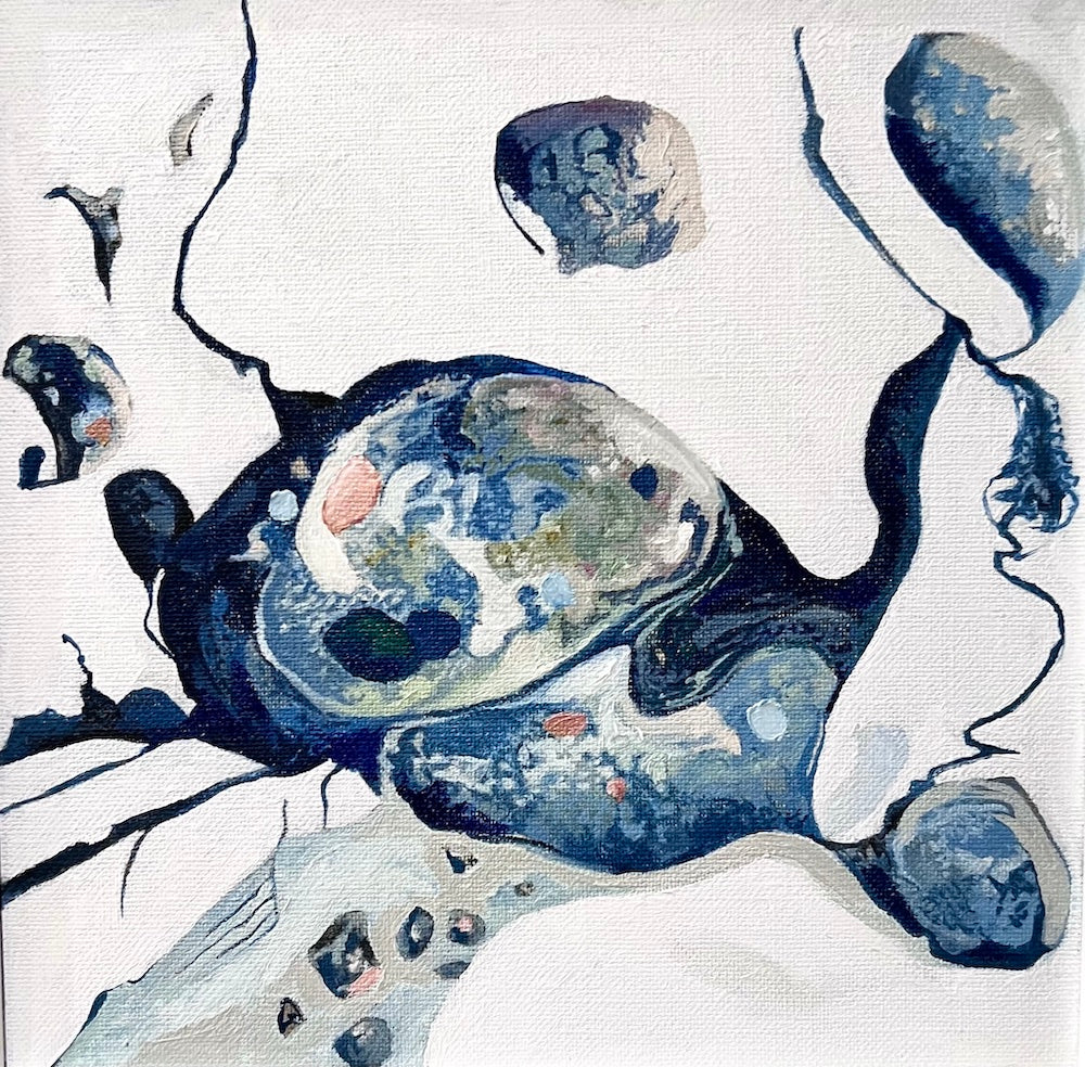 An abstract style rock pool on a white background in shades of blue with multicoloured detail.