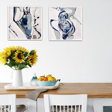 Load image into Gallery viewer, Small oil painting of a rock pool in an abstract style on a white background in shades of blue and multicoloured detail. In situ on a white wall with matching painting.
