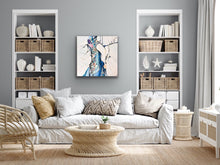 Load image into Gallery viewer, Abstract painting with white background and small multicoloured detail.  In situ on a pale grey wall.
